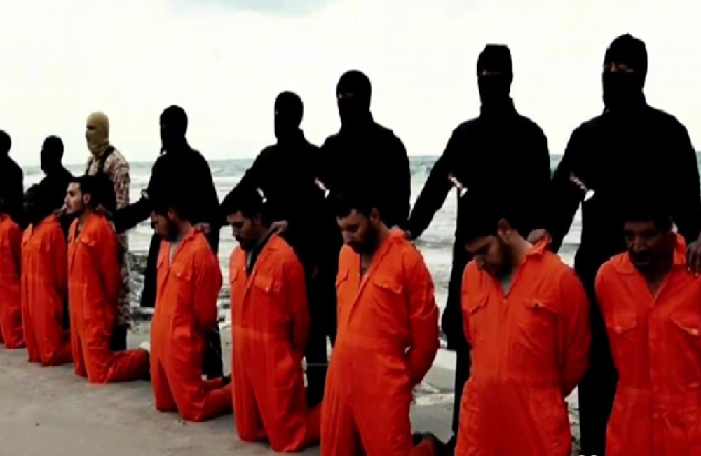 Christians in orange are kneeling, while a black-clad Muslim figure stands behind them, condemning them to be beheaded.